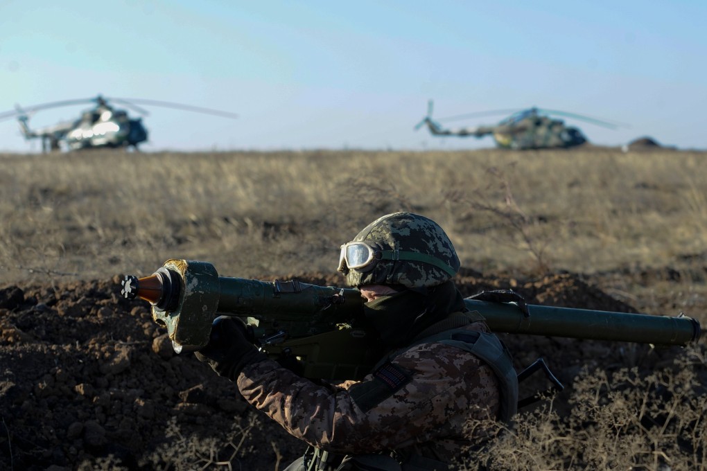 Ukrainain seviceman attends a military drills near Urzuf village not far from the city of Mariupol as Ukraine's president imposed martial law in border regions with Russia. Photo: AFP