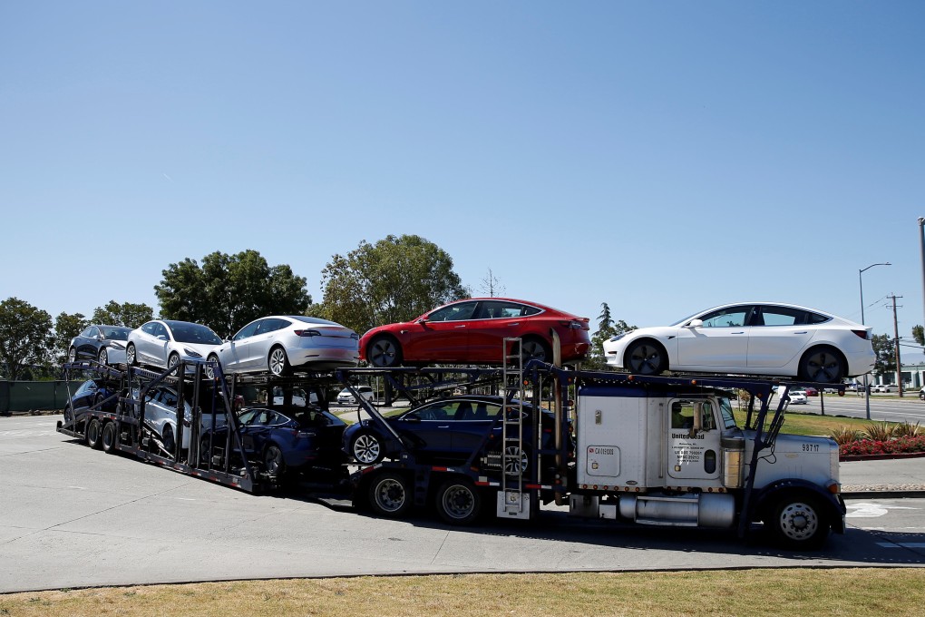 A trailer carrying Model 3 electric sedans leaves the Tesla factory in Fremont, California. Photo: Reuters