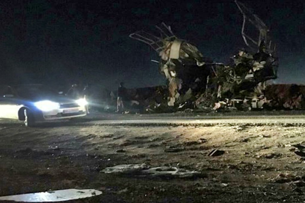 A handout picture released by the Iranian news agency Fars News on Wednesday shows a bus that was reportedly blown up by a suicide attack in southeastern Iran. Photo: AFP
