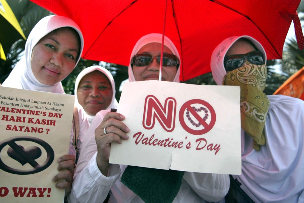 A file photo of Indonesian students holding up anti-Valentine’s Day placards. Photo: AFP