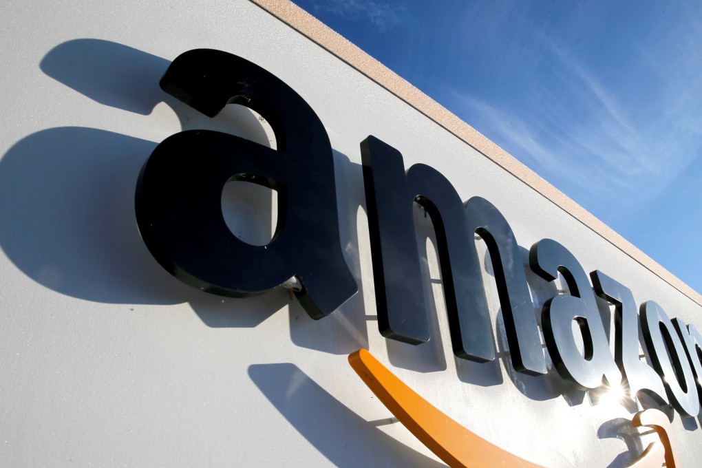The logo of Amazon is seen at the company logistics centre in Boves, France. Photo: Reuters