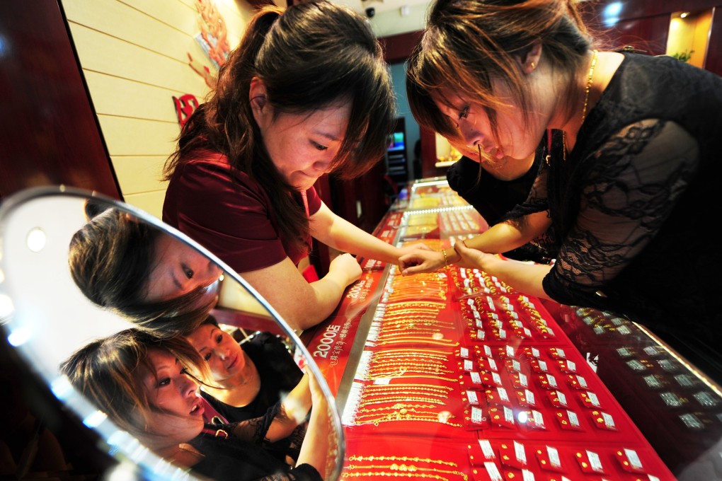 Women shop for jewellery at a shop in Yantai, east China’s Shandong Province. Photo: Xinhua