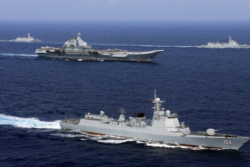 China’s aircraft carrier Liaoning (centre) takes part in a PLA Navy drill in the western Pacific Ocean, in April 2018 Photo: Reuters