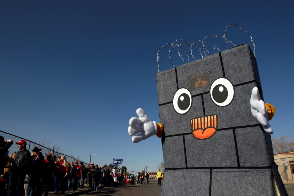 An actor working for the Comedy Central channel’s The Daily Show, costumed as a border wall, is seen as others queue to enter El Paso County Coliseum for a rally by US President Donald Trump in El Paso, Texas. Photo: Reuters