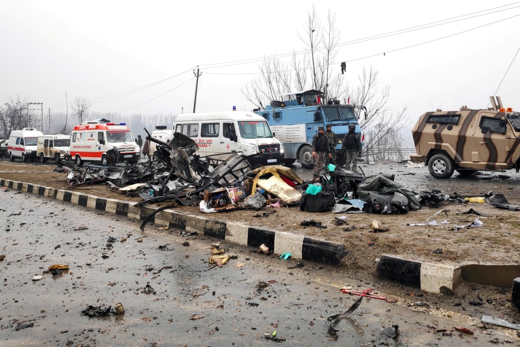 Indian soldiers examine the obliterated remains of a bus after a car-bomb attack in Lethpora, south Kashmir on Thursday. Photo: Reuters