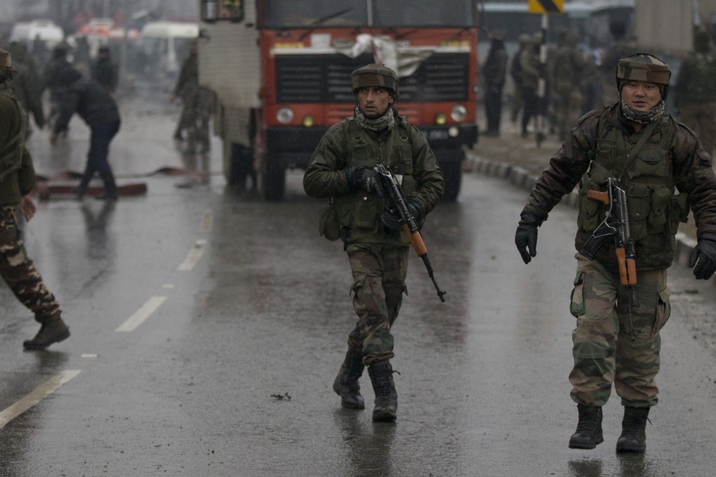 Indian paramilitary soldiers patrol near the site of the explosion. Photo: AP