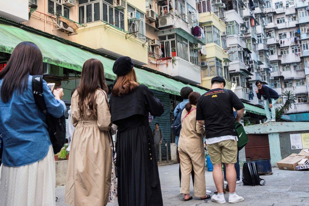 People lining up to take a photo at a popular Instagram spot in a residential area in Quarry Bay, Hong Kong. Photo: AFP