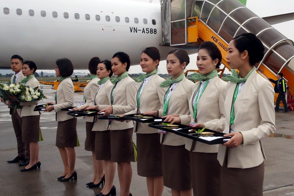Flight attendants on the tarmac at Noi Bai International Airport in Hanoi. Photo: Bloomberg