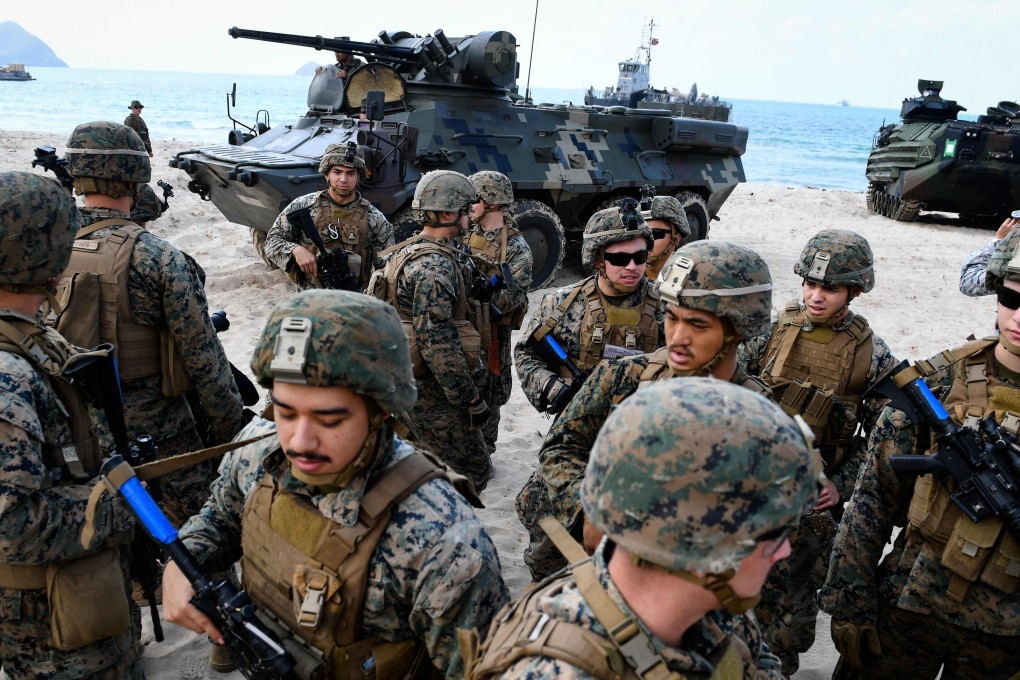 US Marines gather together after an amphibious landing in Chonburi at the Cobra Gold military exercises. Photo: Agence France-Presse