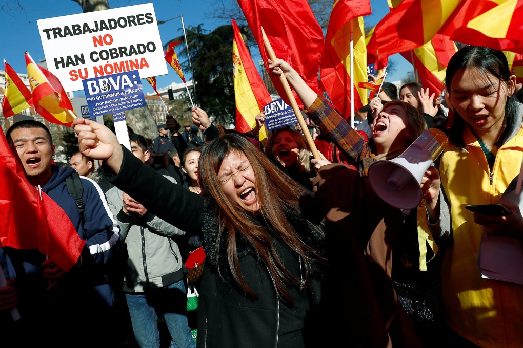 Chinese customers of Spanish bank BBVA protest outside its headquarters in Madrid on Friday. Photo: Reuters