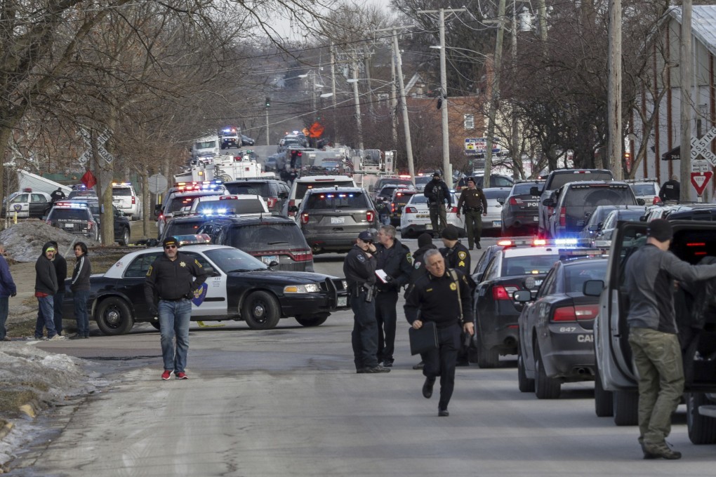 Law enforcement personnel gather near the scene of the shooting in Aurora, Illinois on February 15, 2019. Photo: AP