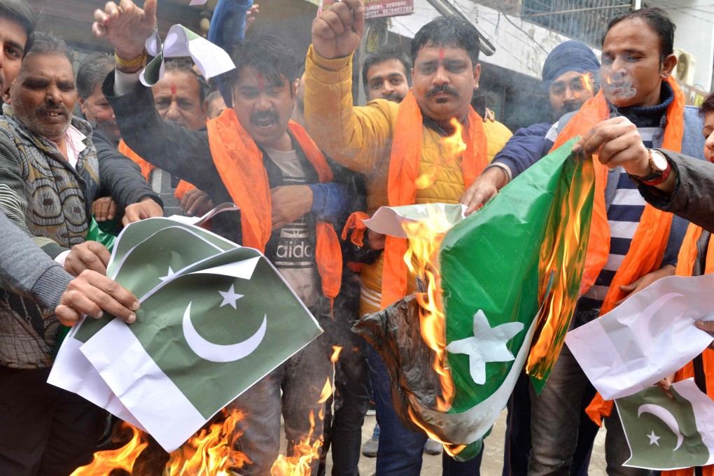 Protesters burn Pakistani flags during a demonstration in Amritsar, India. Photo: AFP