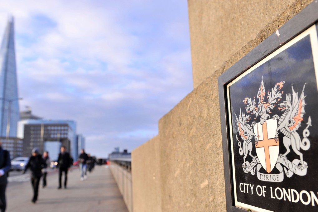 Office workers cross London Bridge into the City of London on March 2, 2017. Photo: AFP