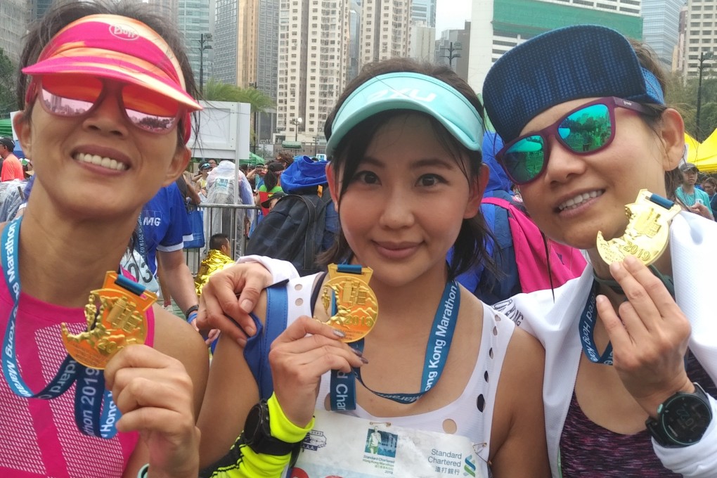 Amy Yan, Jackie Wong and Jessica So after finishing the Hong Kong Marathon. The three train together and are also friends. Photo: Patrick Blennerhassett