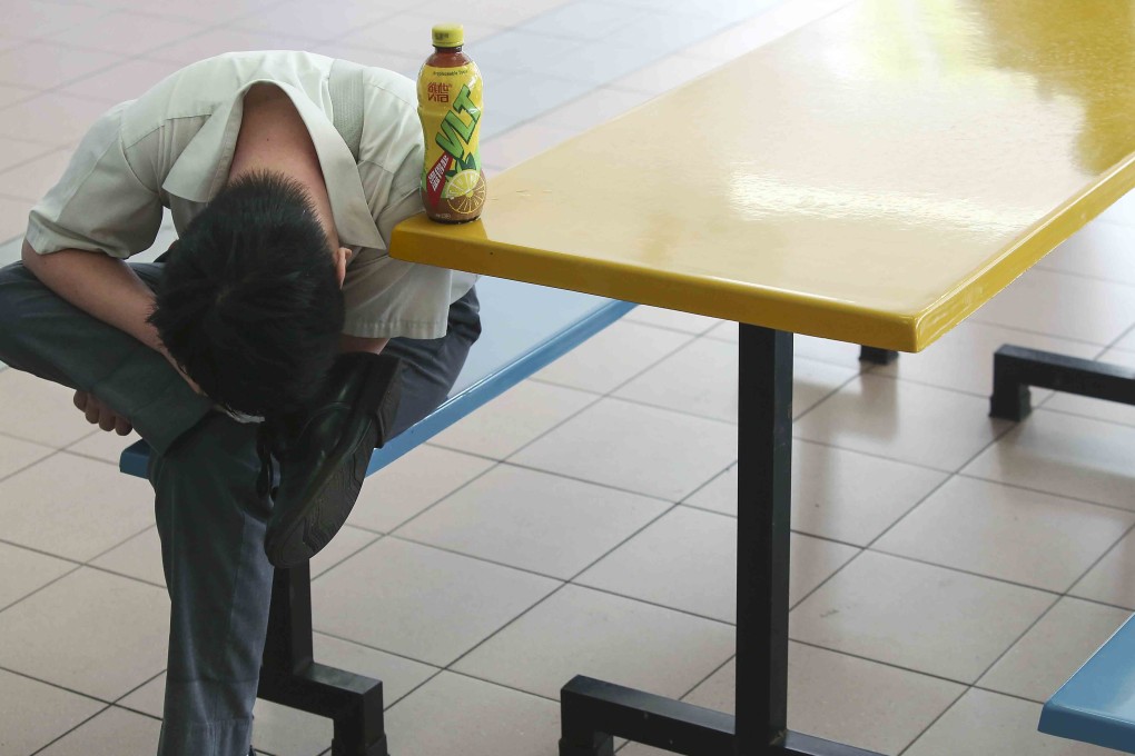 A student takes a break at a food court on Hong Kong Diploma of Secondary Education Examination results day, at a school in Tin Shui Wai in July 2017. Photo: Edmond So
