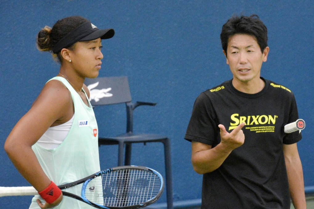 Naomi Osaka of Japan listens to Japan Tennis Association coach Masashi Yoshikawa in Dubai. Photo: Kyodo