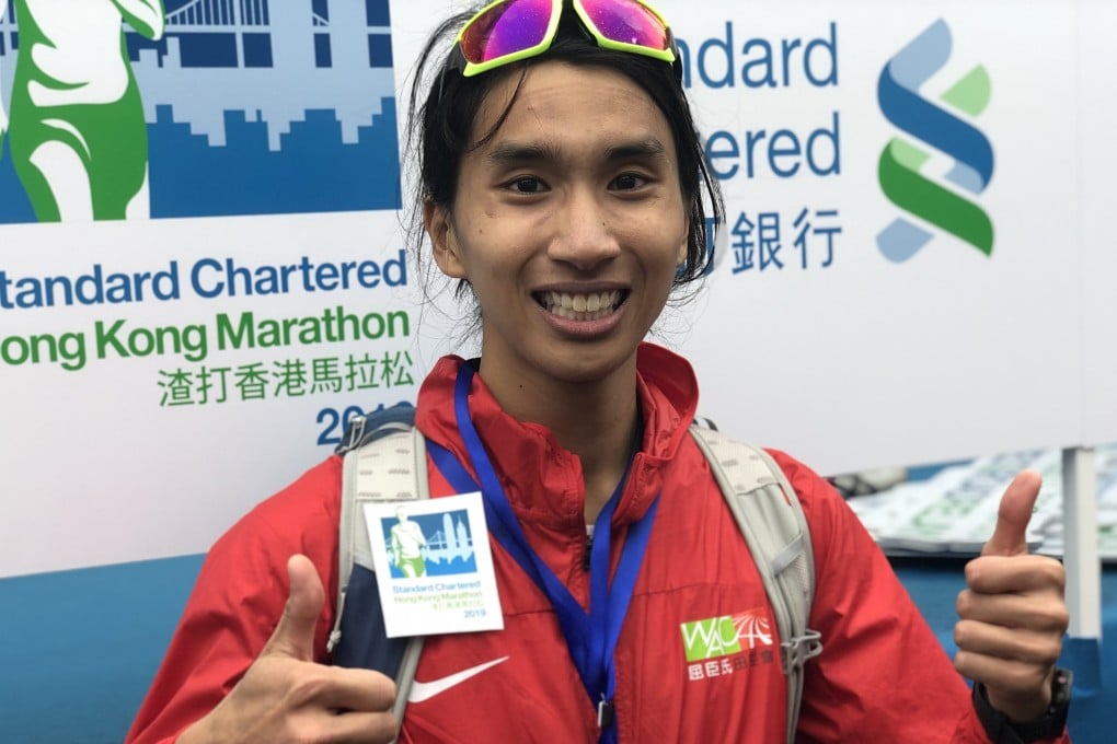 Hanniel Chow Hon-nip celebrates his performance as the best local runner at the Hong Kong Marathon. Photo: SCMP
