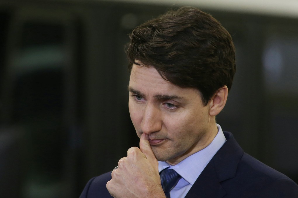 Canada's Prime Minister Justin Trudeau pauses during a visit to the Winnipeg Transit Fort Rouge Garage to make a transit infrastructure announcement in Winnipeg, Manitoba, Canada, February 12, 2019. REUTERS/Shannon VanRaes