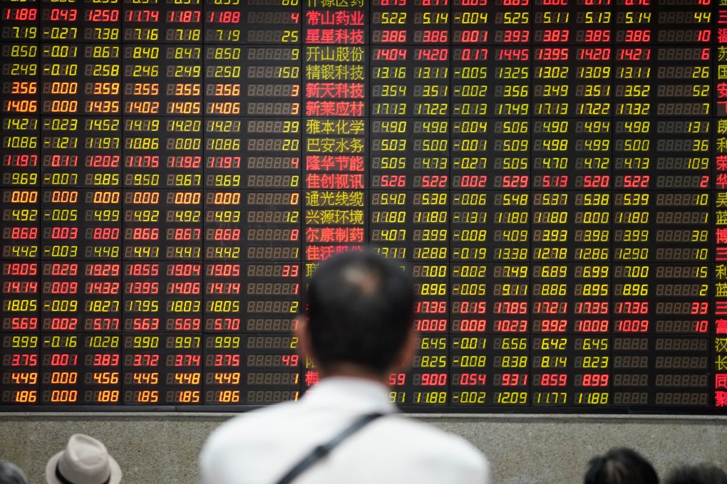 People look at an electronic board showing stock information at a brokerage house in Shanghai on July 6, 2018. Photo: Reuters
