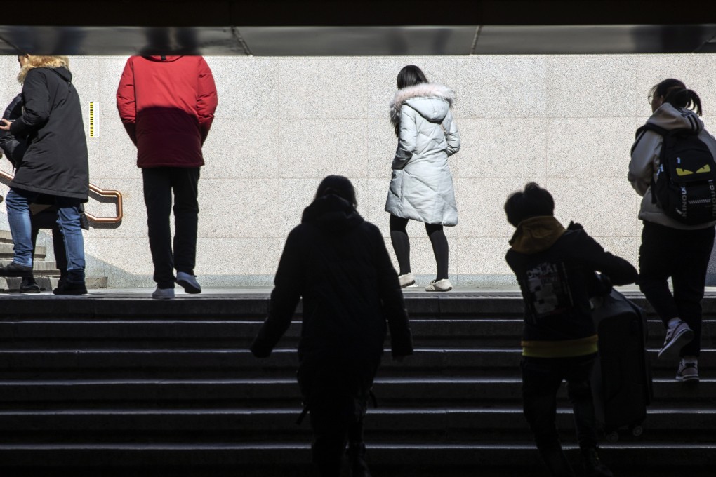 Pedestrians in Beijing. China may be hoping for an early breakthrough on a trade settlement with Washington, but this misses the point. It is the domestic economy that is most at risk and where more of China’s attention is needed. Photo: Bloomberg