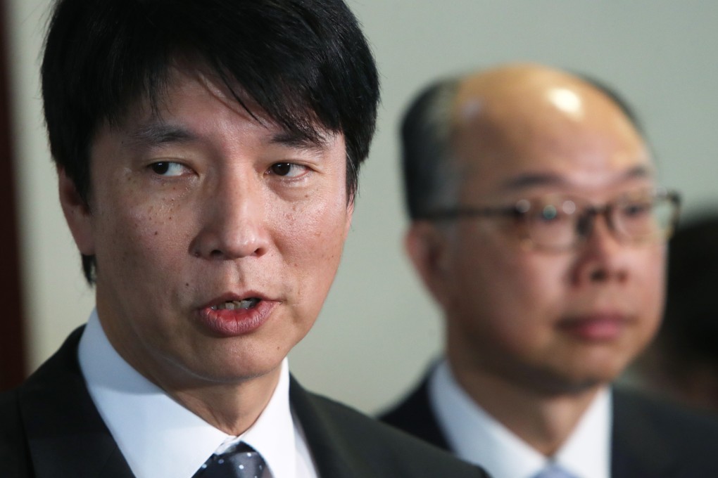 Director of Highways, Jimmy Chan (left) at a meeting of the Legco Transport Panel, with Transport Secretary Frank Chan in the background. Photo: Winson Wong