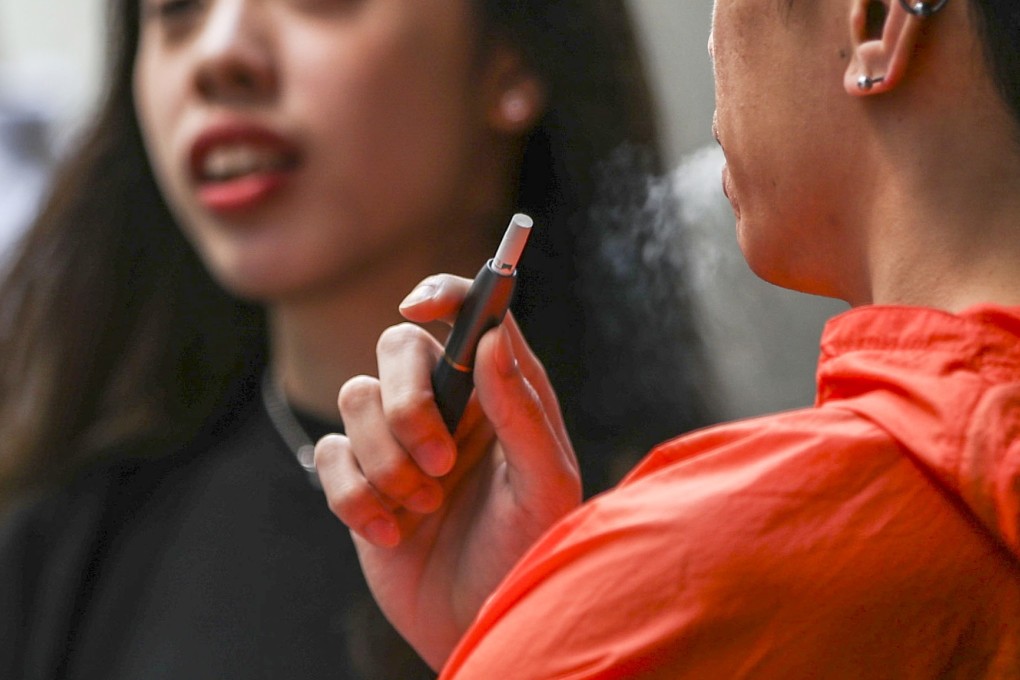 A bill to amend the Smoking Ordinance proposes to subject anyone who brings in, imports, makes, sells, distributes or promotes new smoking products in Hong Kong – including e-cigarettes, heat-not-burn products and herbal cigarettes – to a maximum penalty of six months in jail and a fine of HK$50,000 if convicted. The first reading will take place on February 20. Photo: Edward Wong