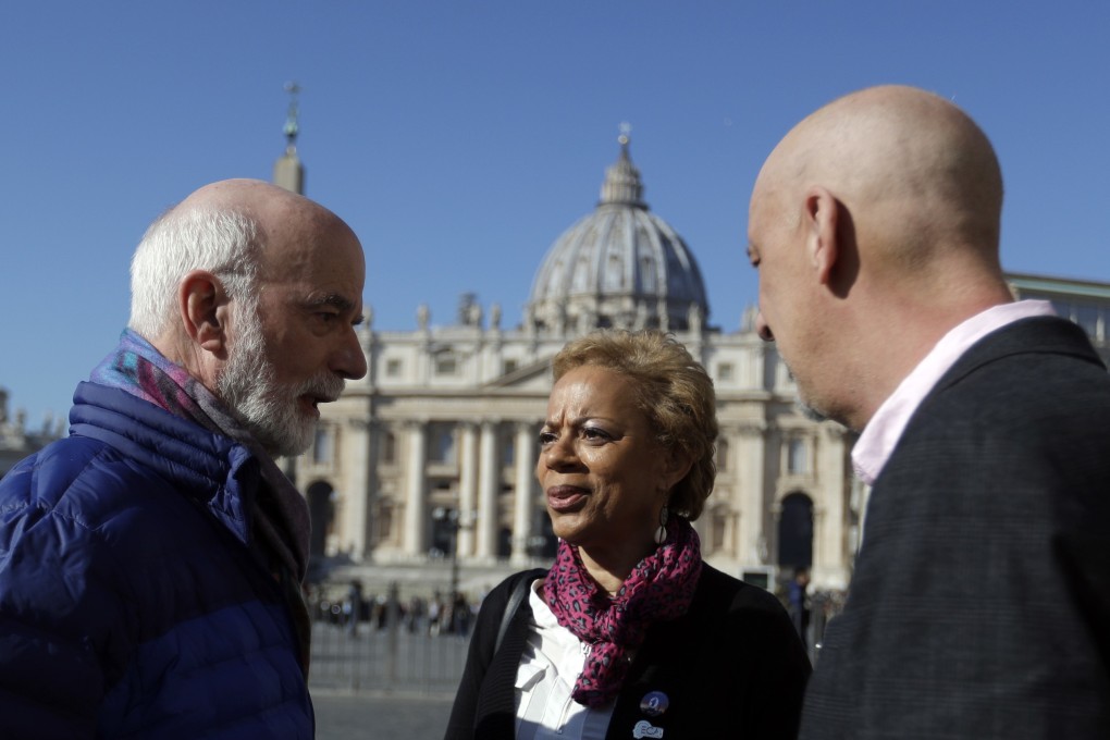 From left, Timothy Law, President of the ECA (Ending Clergy Abuse) organisation, Denise Buchanan and Peter Isely, both founding member of the ECA talk to each other during an interview by The Associated Press in St Peter's Square at the Vatican. Photo: AP Photo