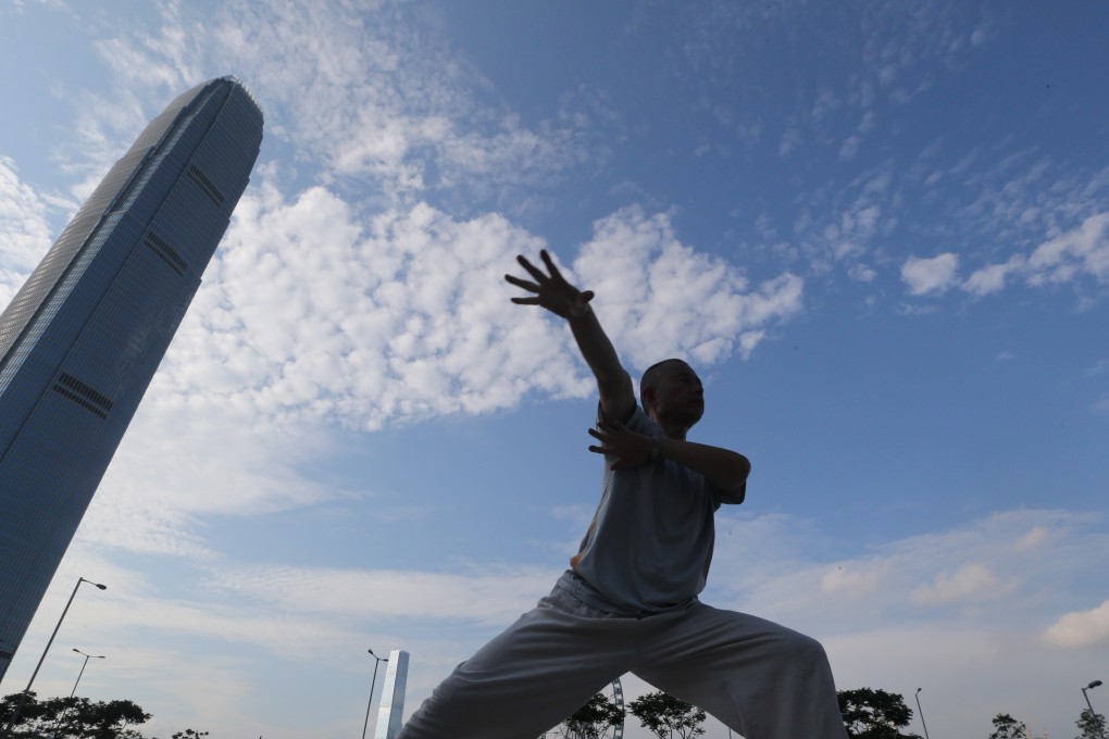 A woman practises tai-chi in Central. Photo: David Wong