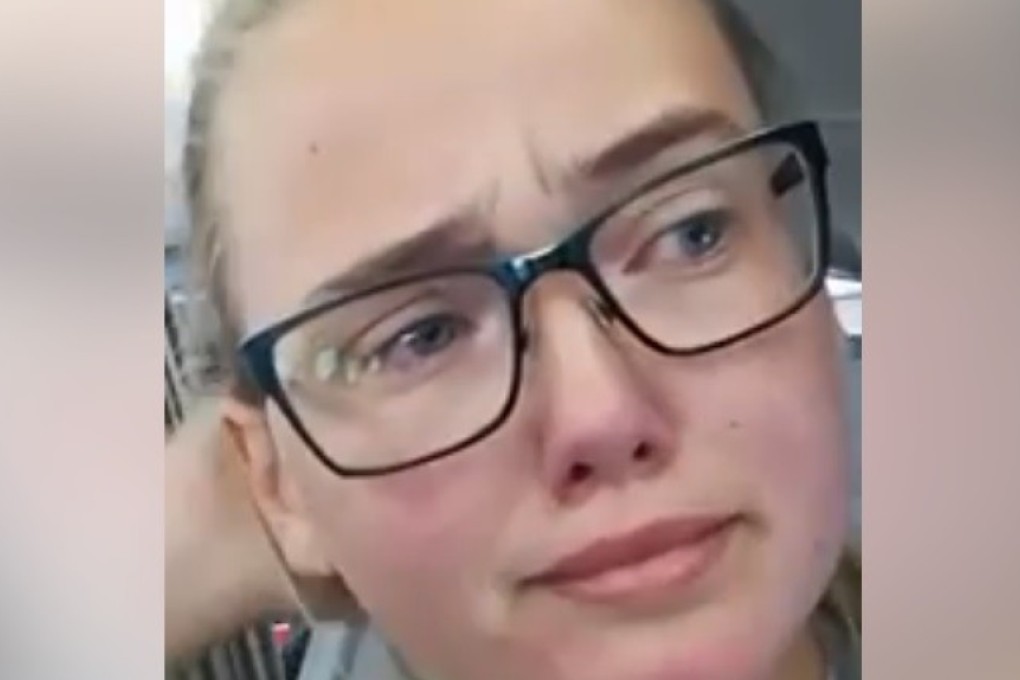 Screen capture of Elin Ersson’s live feed as she stops a man’s deportation on a flight. Photo: Elin Ersson/Facebook