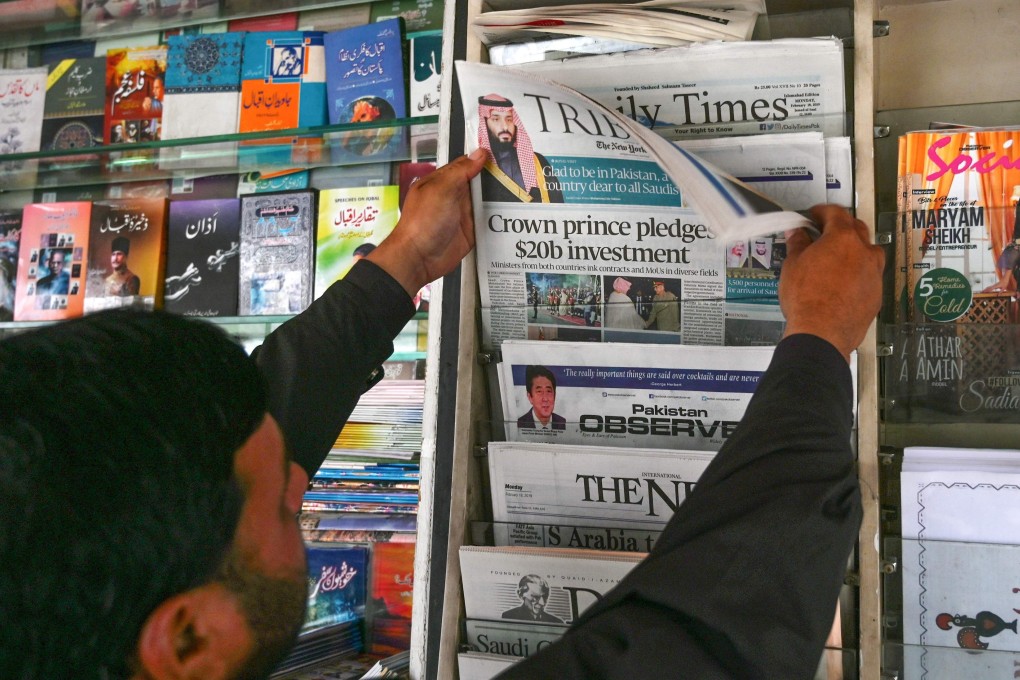 A Pakistani man looks at morning newspapers with front-page-coverage of Saudi Arabian Crown Prince Mohammed bin Salman. Photo: AFP