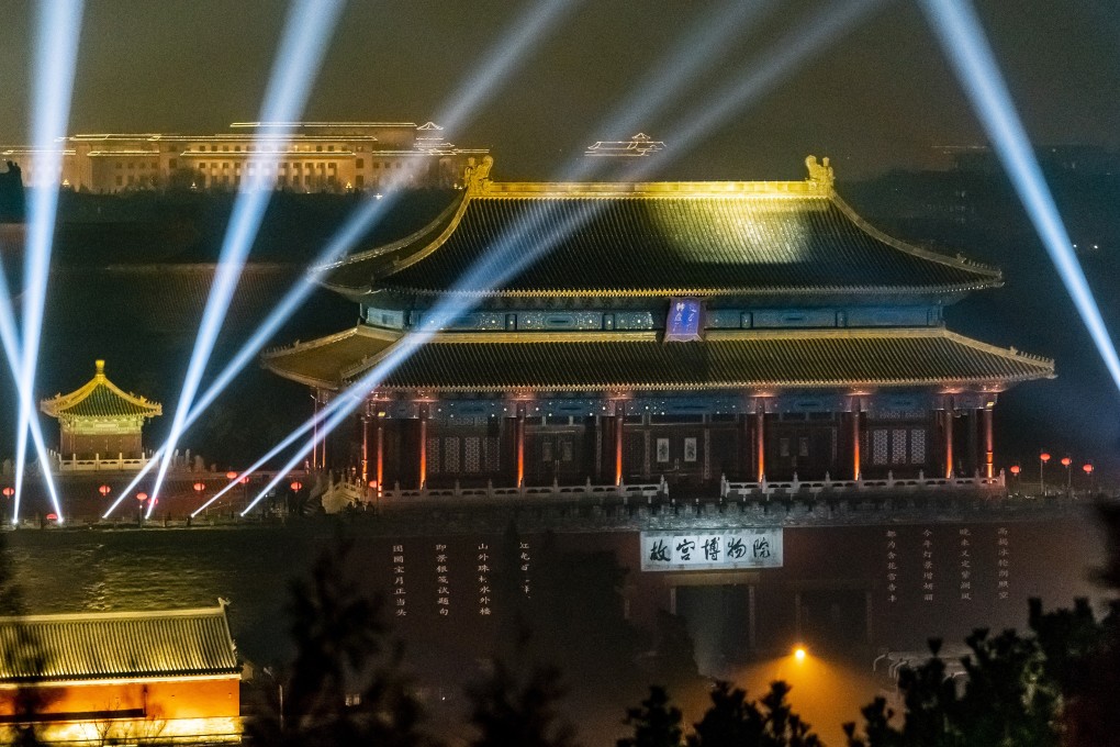 Lasers light up the Palace Museum and the night sky in Beijing. Photo: Xinhua