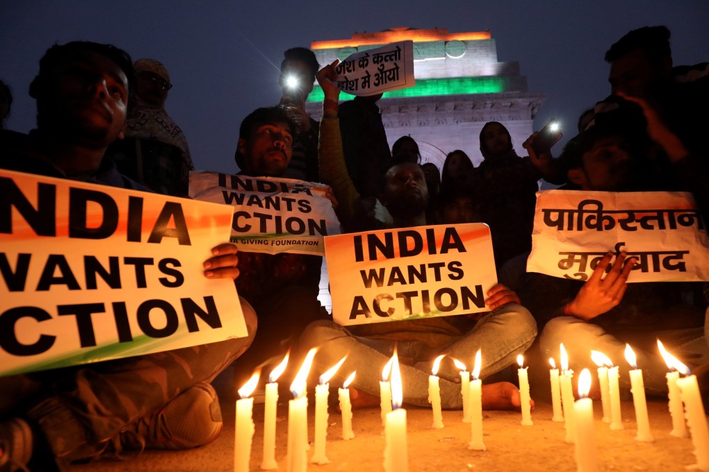 Demonstrators demand action at a candle light vigil held in India in the wake of the suicide bombing. Photo: Reuters