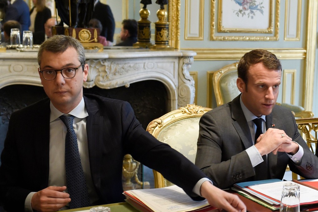 French president Emmanuel Macron (R) flanked by Secretary General of the Elysee presidential Palace Alexis Kohler (L) attend a weekly Defence Council at the Elysee Palace in Paris. Photo: AFP