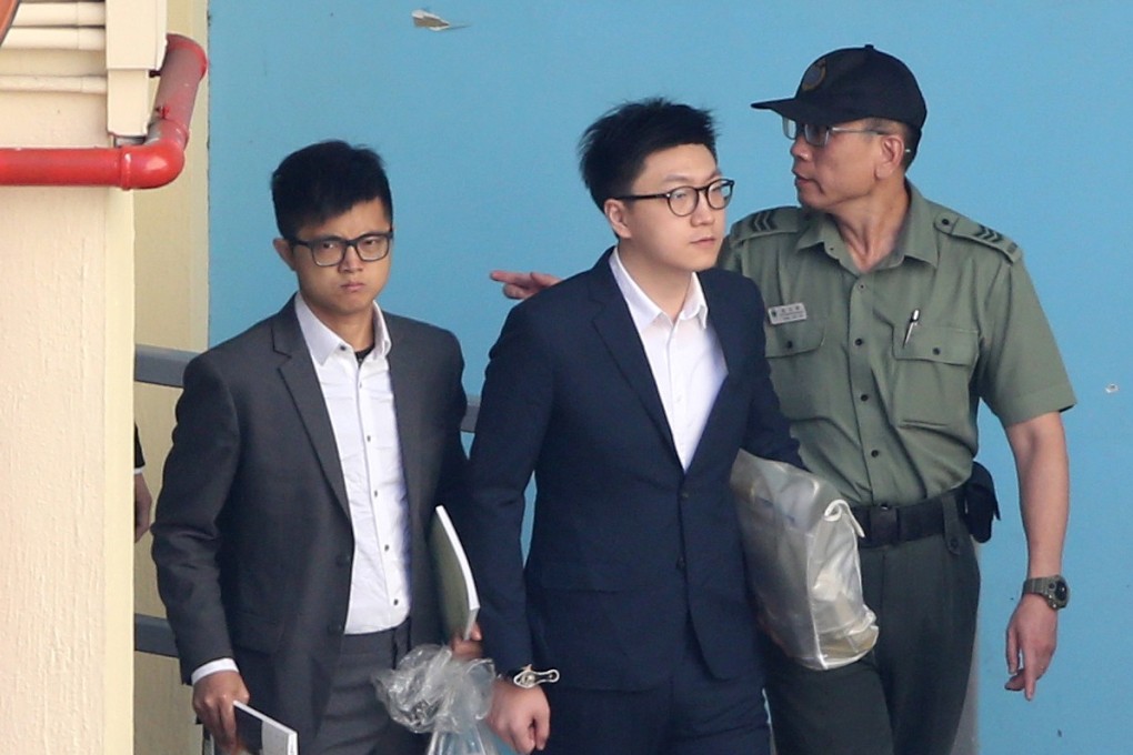 Edward Leung (centre) escorted by a Correctional Services Department officer. Photo: Sam Tsang