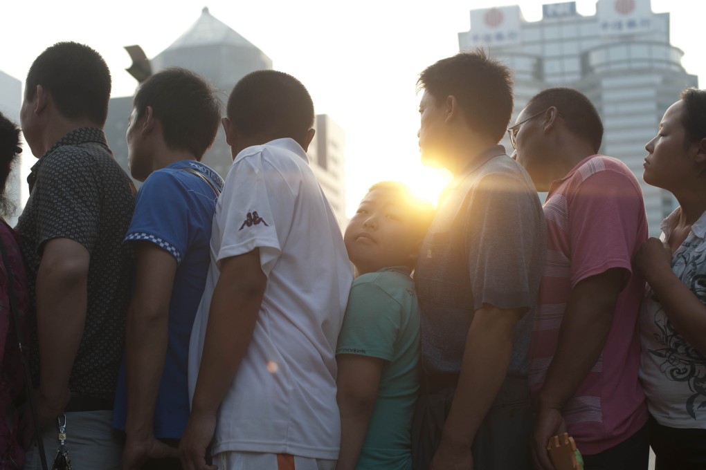Hundreds of Chinese parents queuing up to see a doctor in the morning outside a children's' hospital in Beijing. Photo: AFP