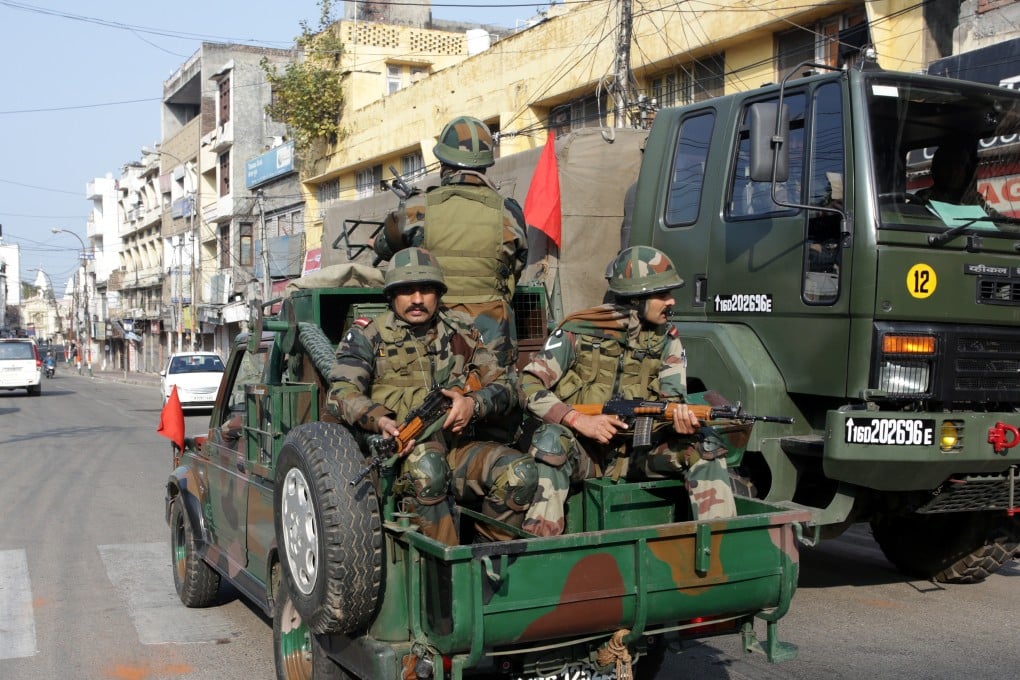 Indian army soldiers carry out a flag march in Jammu. Photo: EPA-EFE