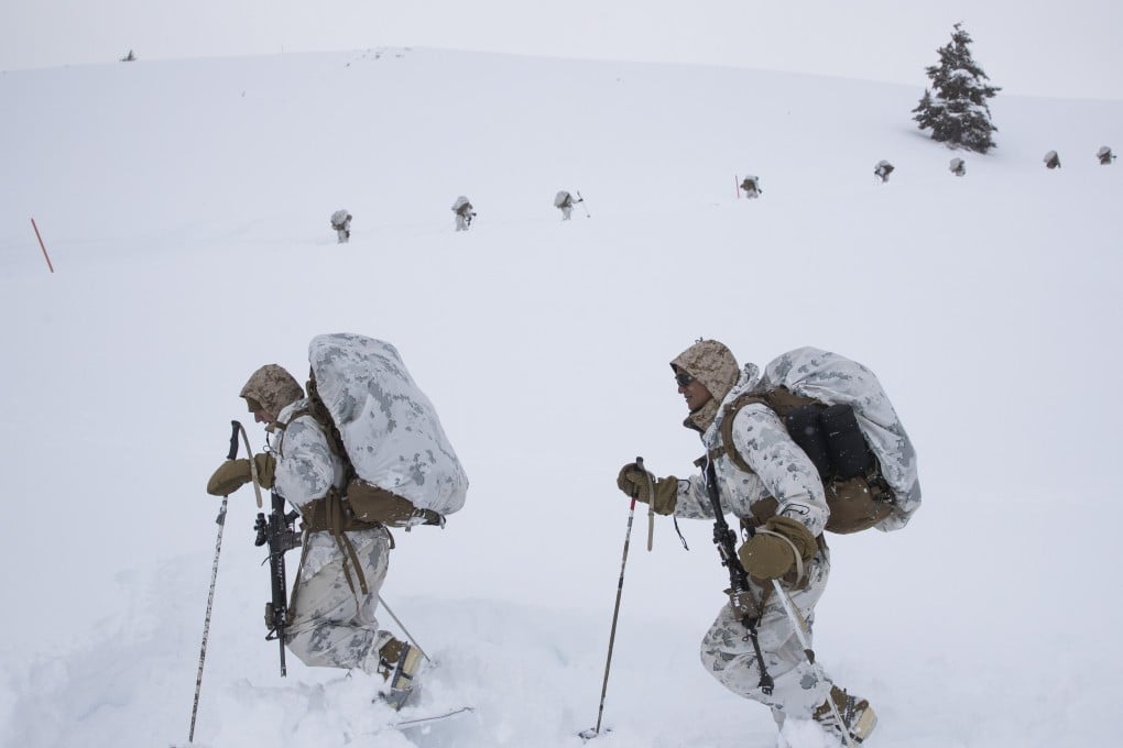 US Marines walk along a snow-covered trail during cold-weather training at the Marine Corps Mountain Warfare Training Centre on Sunday. Photo: AP