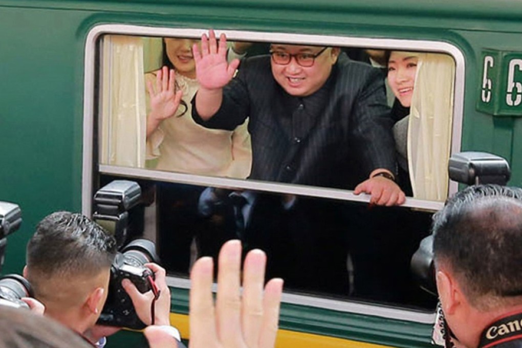 North Korean leader Kim Jong-un waves from his train in Beijing. Photo: AP