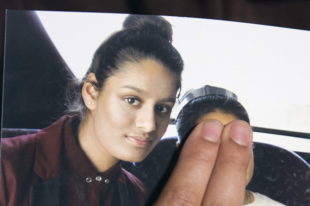 Shamima Begum is seen in a photo being held by her sister Renu Begum in 2015. The child in the photo is being deliberately obscured by Renu Begum. Photo: AFP