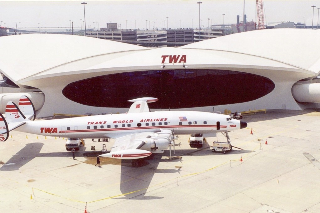 The TWA Flight Center with a Lockheed Constellation in the foreground in the 1960s. The building will reopen as the TWA Hotel.