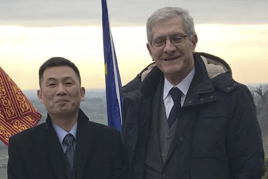 North Korean diplomat Jo Song-gil pictured with Italian senator Valentino Perin on January 3. Photo: AP