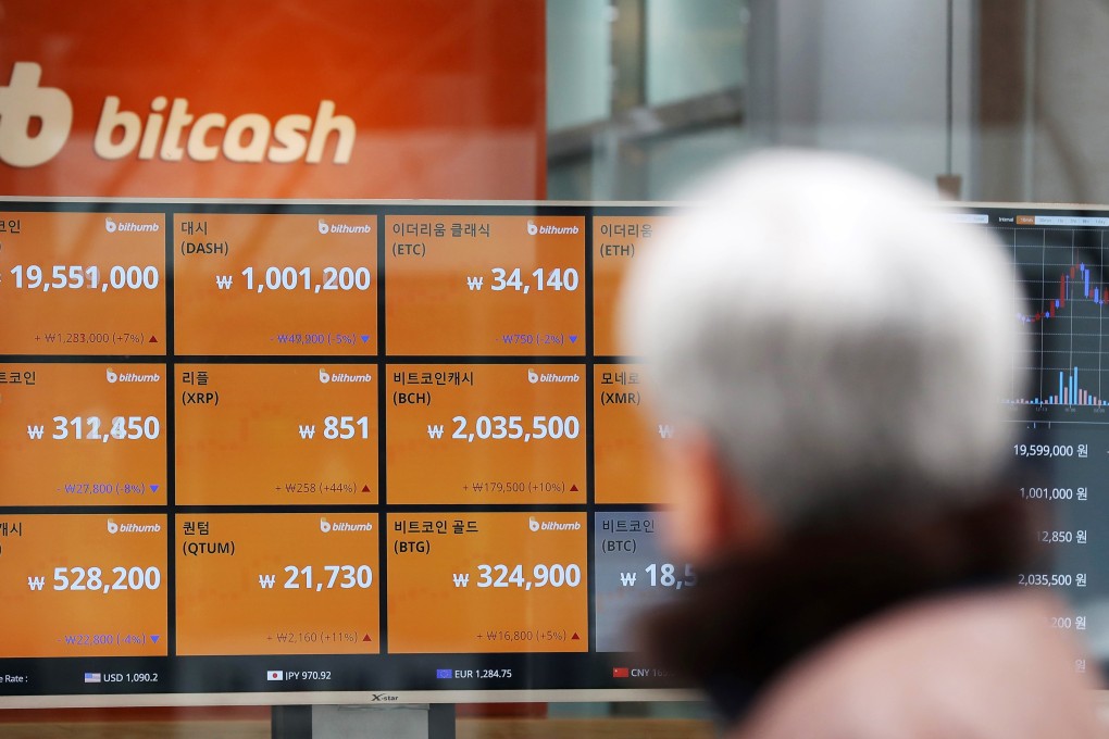 Virtual currency prices are shown on monitors at the Bithumb exchange office in Seoul. Photo: Bloomberg photo by Seongjoon Cho