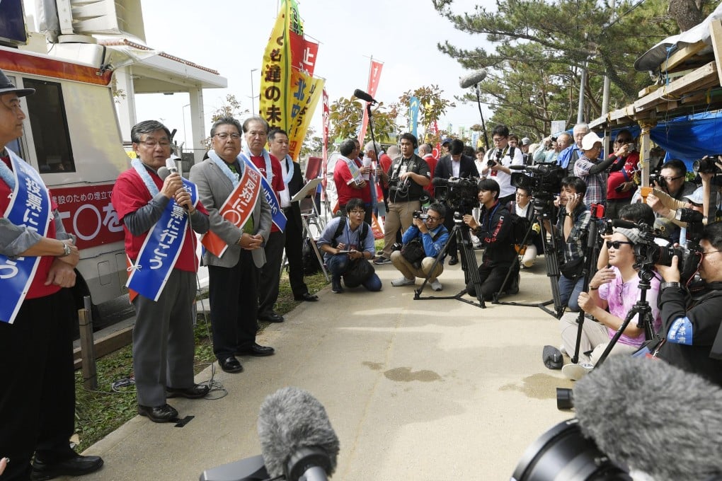 Residents gather at the US Marine Corps' Camp Schwab to oppose a controversial plan to relocate troops within the southern island prefecture. Photo: Kyodo