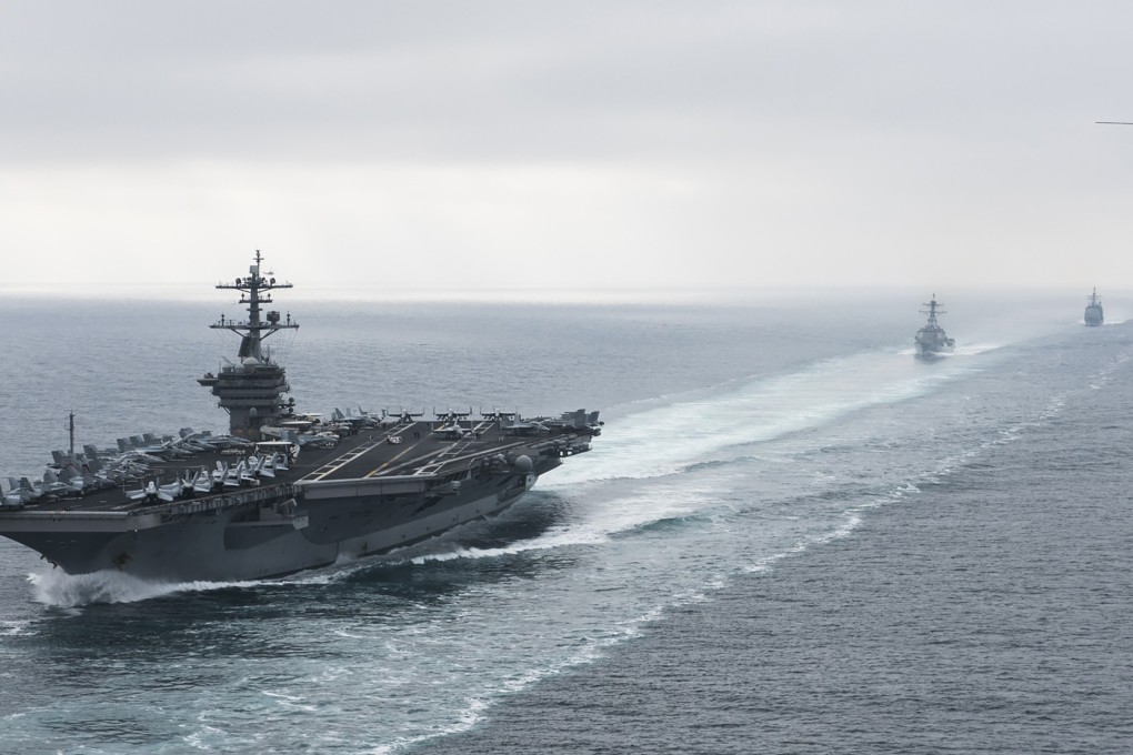 The aircraft carrier USS Theodore Roosevelt, the guided missile destroyer USS Halsey and the guided missile cruiser USS Bunker Hill underway during exercises in the Pacific Ocean in 2017. Photo: AFP