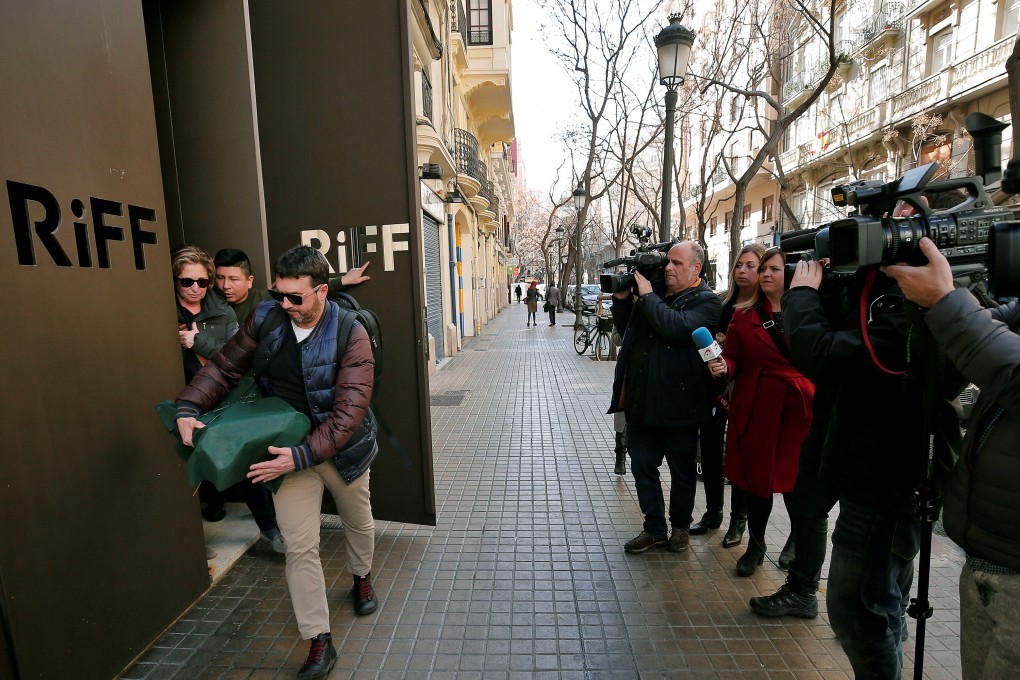 Regional health officials leave the Michelin-starred restaurant RiFF in Valencia, eastern Spain, on Tuesday. Photo: EPA