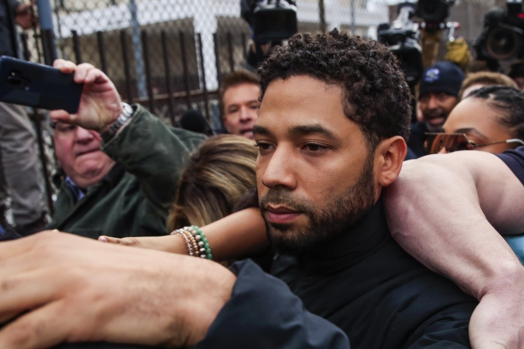 Actor Jussie Smollett emerges from the Cook County Court complex. He has been charged with felony disorderly conduct for allegedly filing a false police report claiming he was attacked. Photo: EPA-EFE