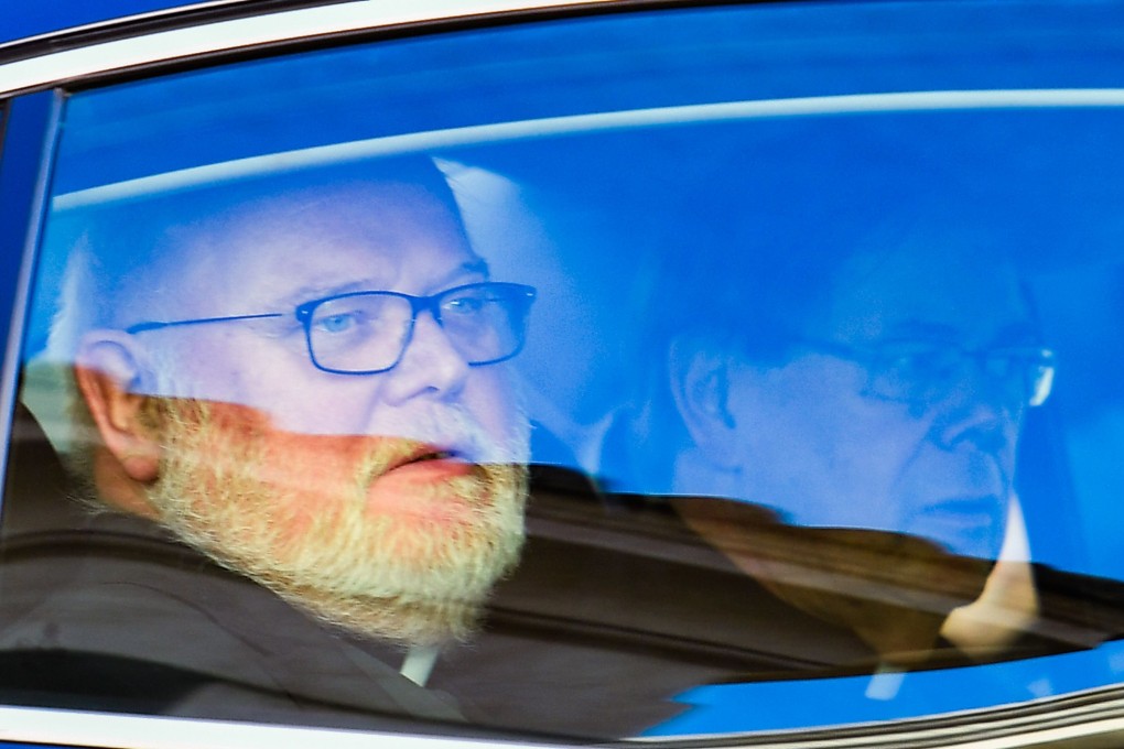 German Cardinal Reinhard Marx leaves in a car after addressing the third day of a landmark Vatican summit on tackling paedophilia in the clergy. Photo: AFP