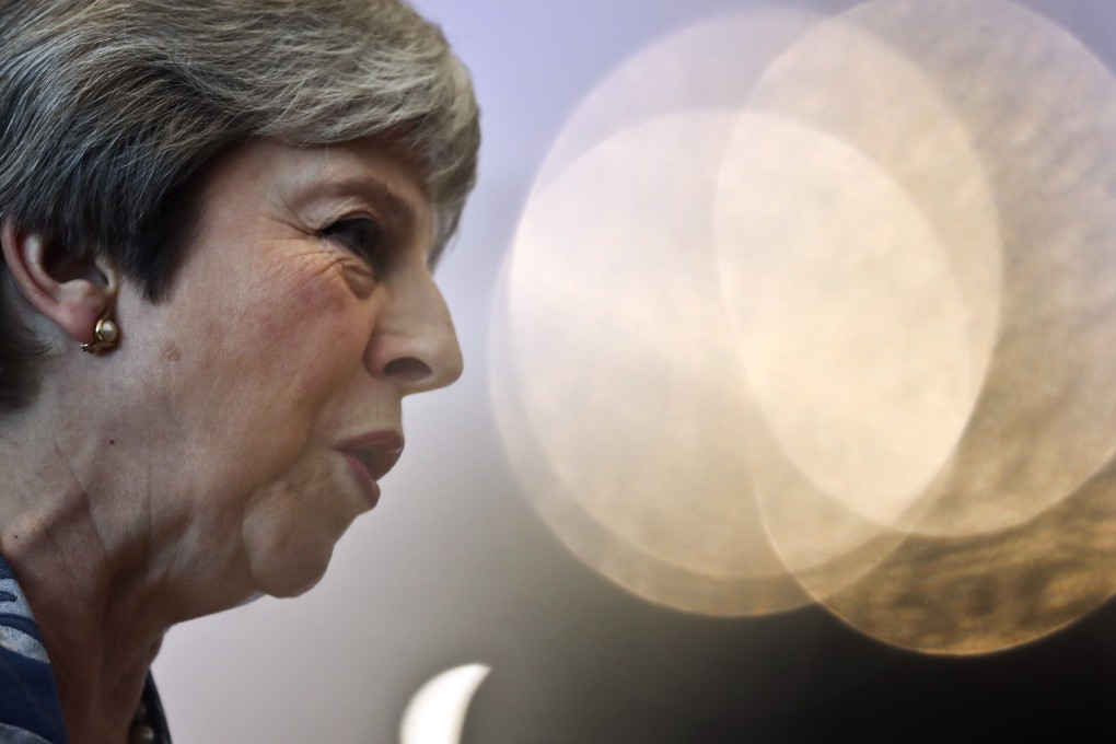 British Prime Minister Theresa May speaks with the media as she arrives for an EU-Arab summit at the Sharm el-Sheikh convention centre. Photo: AP Photo