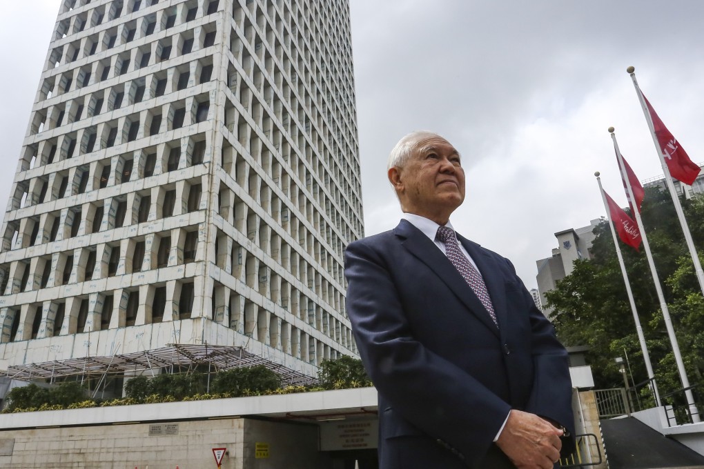 AIA Group’s Edmund Tse Sze-wing stands outside the AIA building in Wan Chai. Locals say the windows look like coffins, which brings luck. Photo: Jonathan Wong