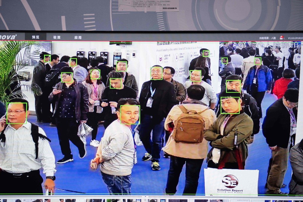 A screen shows visitors being filmed by AI security cameras with facial recognition technology at the 14th China International Exhibition on Public Safety and Security in Beijing on October 24, 2018. Photo: AFP